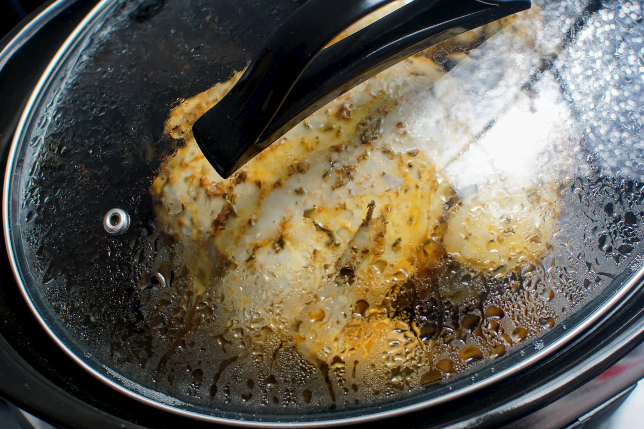Seasoned chicken slow cooking in a CrockPot
