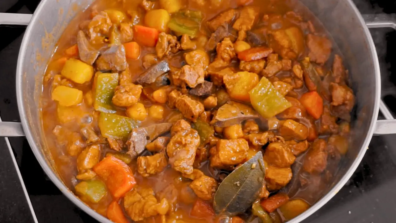 Easy Pork Menudo, fiesta style, with garbanzos simmering in the pot