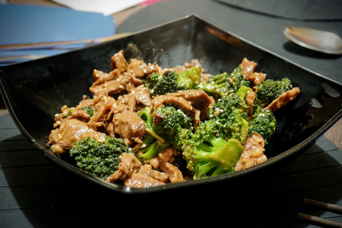 Beef Broccoli serve in a black bowl