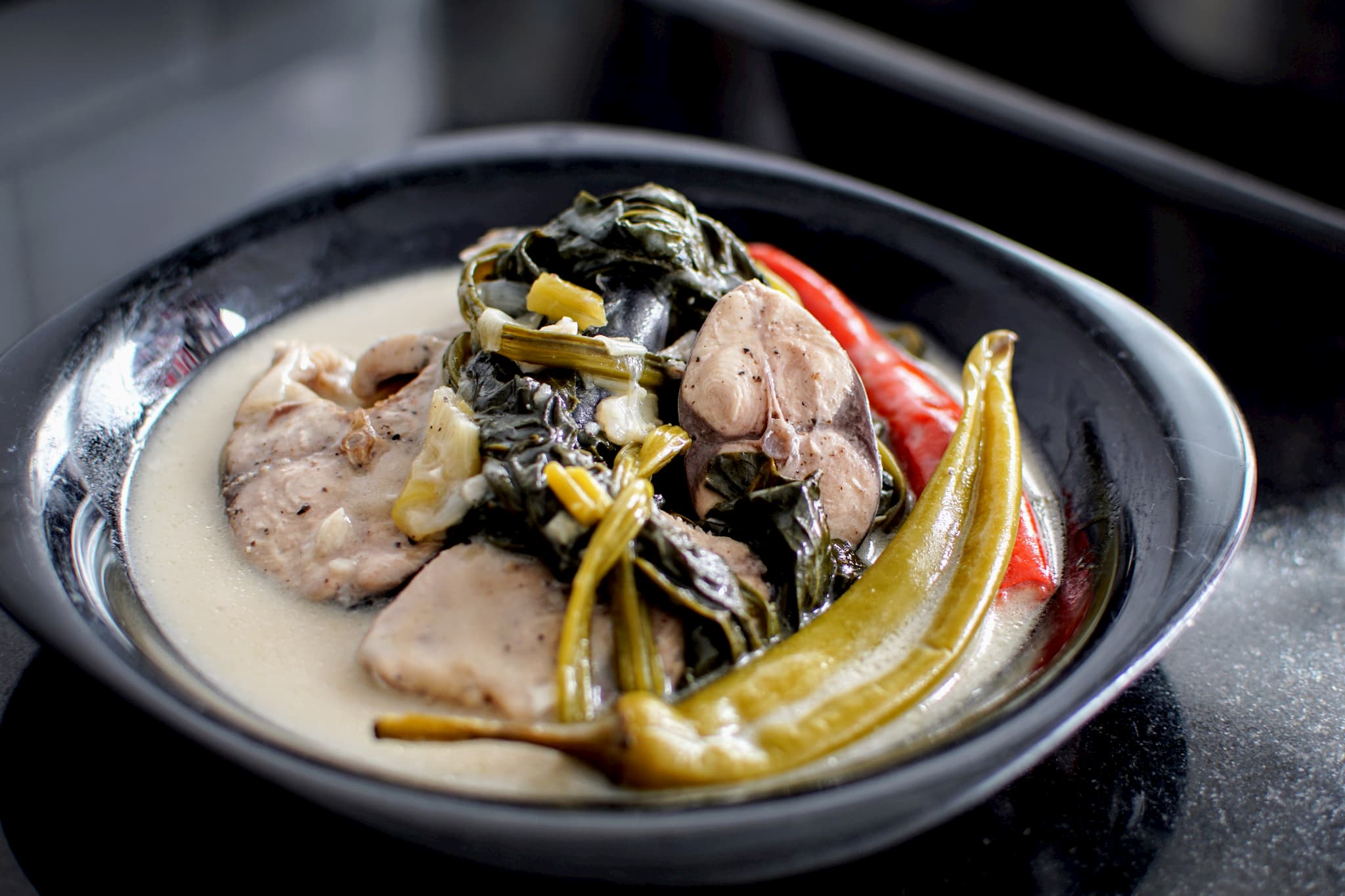 Bonito fish slices cooked in coconut milk