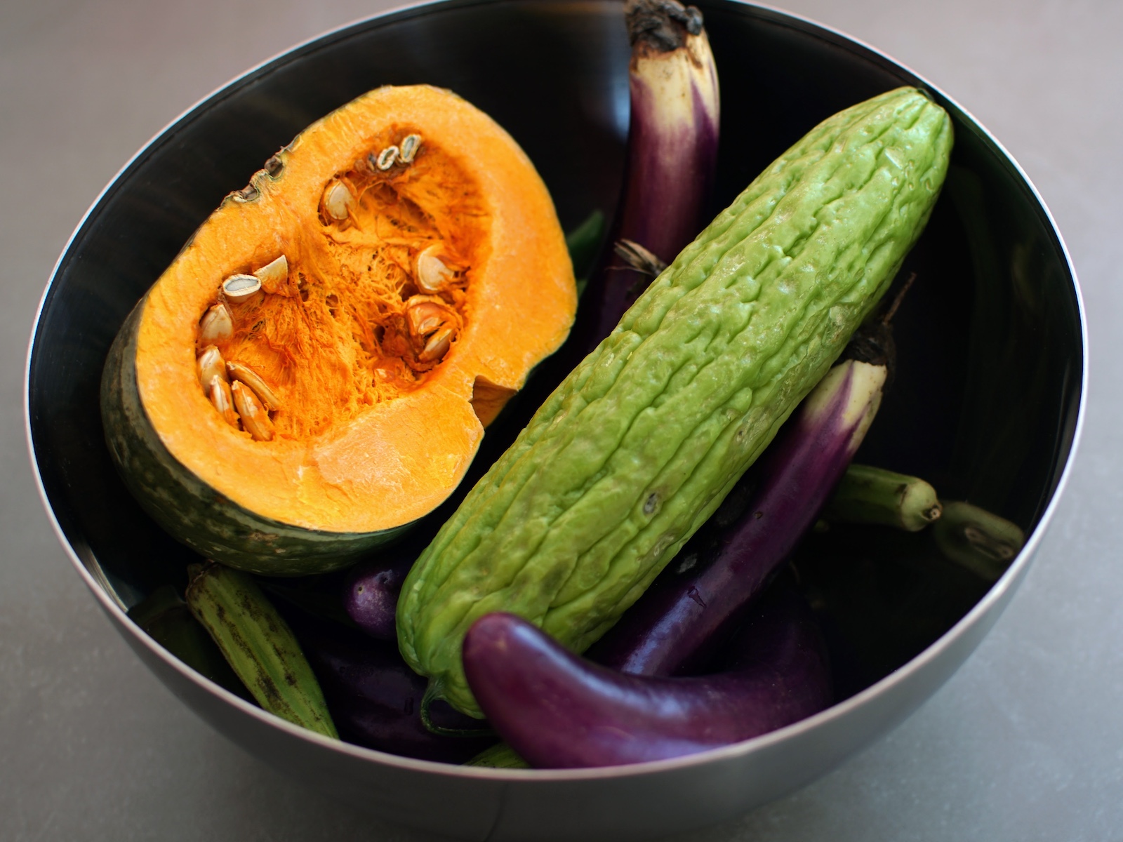 Pinakbet vegetable ingredients in a metallic bowl