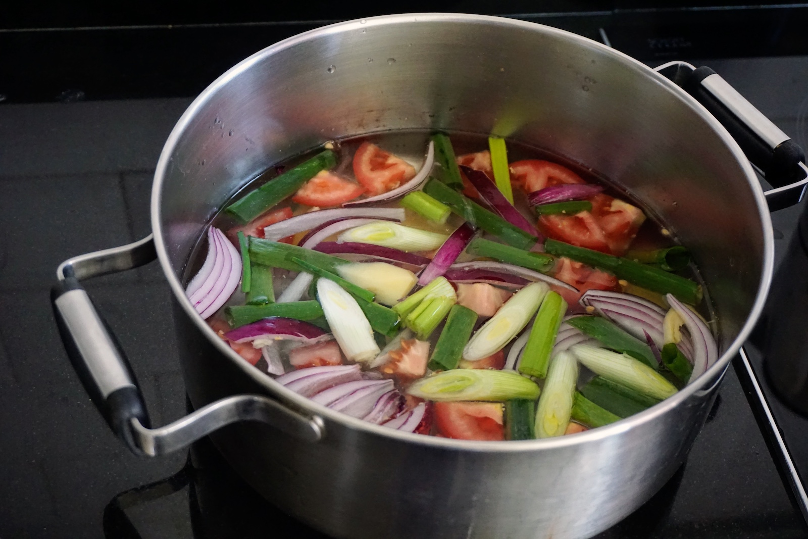 Sinigang base ingredients in a pot