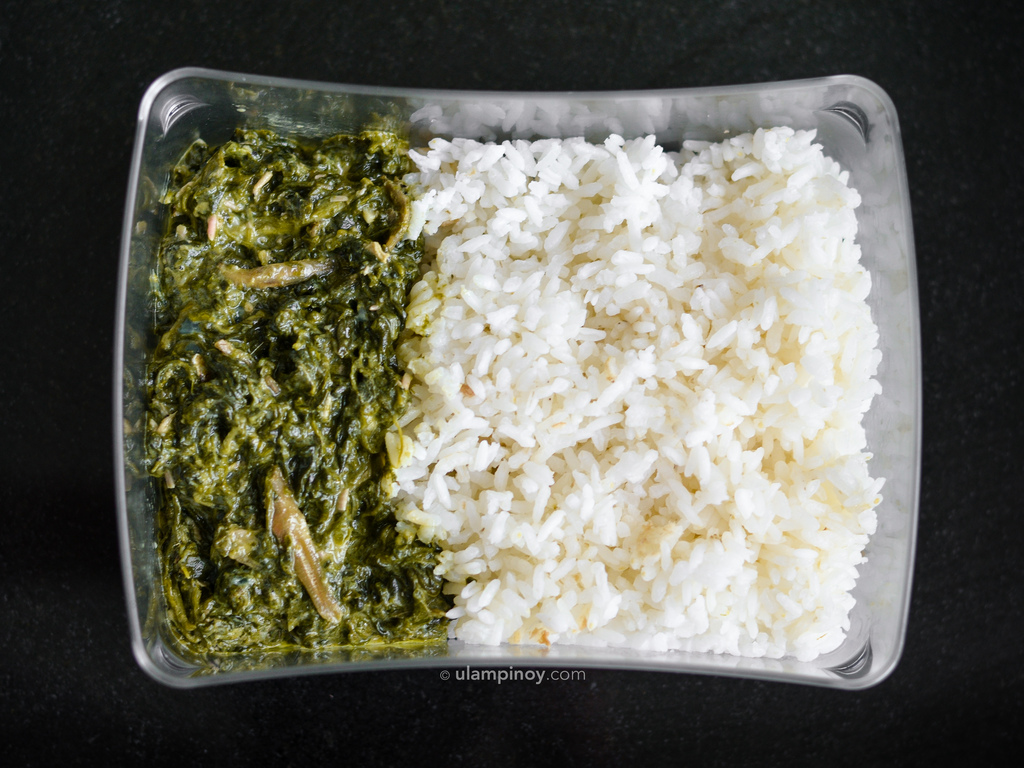Lunchbox of rice and laing of spinach